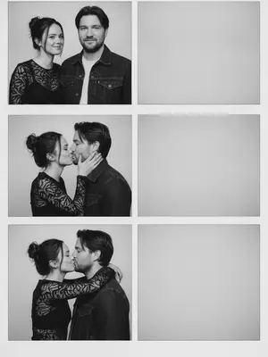 In a vintage black-and-white photobooth strip, a man and a woman are captured in four frames. The man dons a dark denim jacket over a light T-shirt, while the woman wears a fitted semi-sheer black long-sleeve top with delicate patterns. The energy between them is candid and authentic, with a natural, imperfect pose that feels unpolished and asymmetrical. The frames are stacked in a single column, each one showcasing a different moment. The background is a simple light studio setting, with white borders and square corners, evoking a realistic analog photobooth vibe.

In the first frame, they stand side by side facing the camera, the woman on the left and the man on the right. The woman's head is slightly turned to the right, with a flirtatious smile and a sidelong glance, creating a symmetrical yet slightly off-center composition. Moving to the second frame, the woman turns towards the man, gently cupping his cheek with a bright smile, while he looks back at her with a soft expression. Their closeness creates a left-weighted composition with empty space on the right.

In the third frame, the couple shares a kiss in profile, the woman on the left and the man on the right, positioned towards the left side of the frame with extra space on the right. Her hand rests on his cheek as they embrace. Finally, in the fourth frame, the woman hugs the man from behind over his shoulders, leaning her head towards him from the upper left corner, while he smiles at the camera. The couple is close to the left side of the frame, leaving the right half empty for a balanced yet intimate composition. 